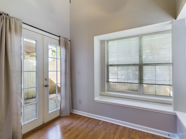 entryway featuring french doors and wood-type flooring