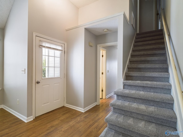 interior space with wood-type flooring and a textured ceiling