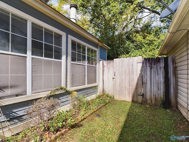 view of property exterior with a yard