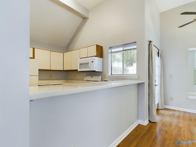 kitchen featuring ceiling fan, high vaulted ceiling, white appliances, cream cabinetry, and light wood-type flooring