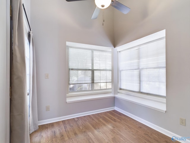 spare room featuring light hardwood / wood-style floors and ceiling fan