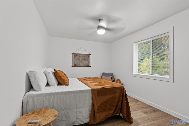 bedroom featuring light hardwood / wood-style floors and ceiling fan