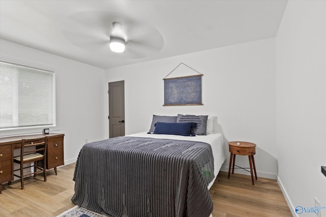 bedroom featuring hardwood / wood-style floors and ceiling fan