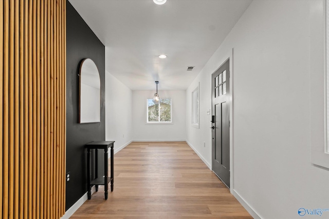 hallway with light wood-type flooring