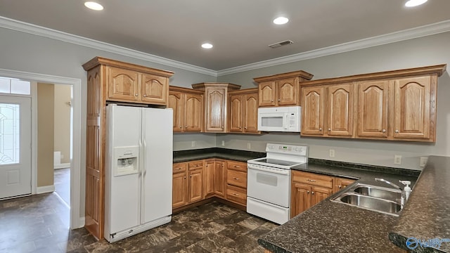 kitchen with white appliances, visible vents, crown molding, and a sink
