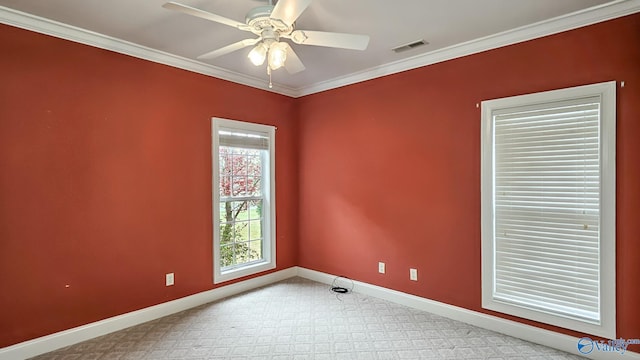 unfurnished room featuring baseboards, ornamental molding, visible vents, and a ceiling fan