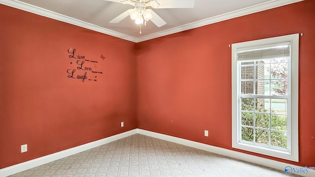 empty room featuring baseboards, ornamental molding, and a ceiling fan