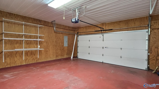 garage with electric panel and a garage door opener