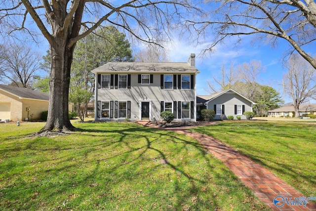 1816 Devonshire Dr SE, Decatur, AL 35601 - colonial-style house with a chimney and a front lawn