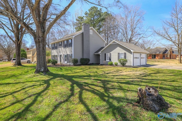 1816 Devonshire Dr SE, Decatur, AL 35601 - view of front of house featuring concrete driveway, an attached garage, a chimney, and a front yard
