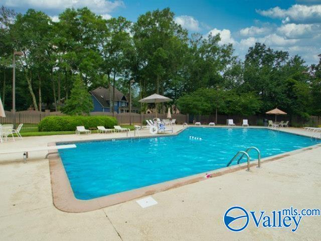 1816 Devonshire Dr SE, Decatur, AL 35601 - community pool with a patio and view of scattered trees