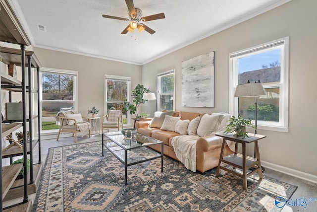 1816 Devonshire Dr SE, Decatur, AL 35601 - living area featuring a ceiling fan, ornamental molding, wood finished floors, and baseboards