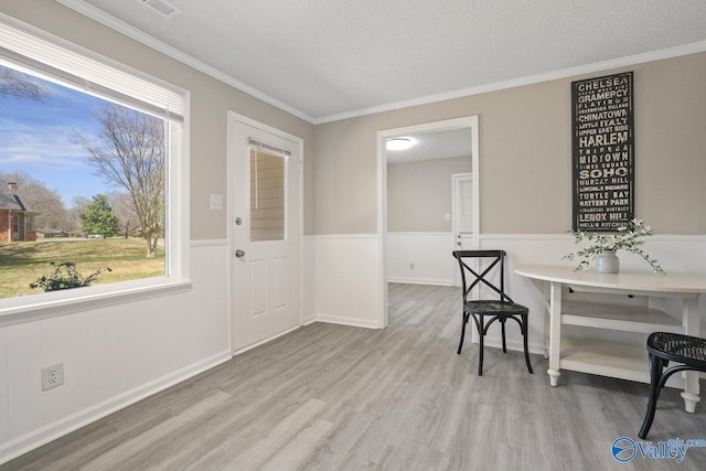 1816 Devonshire Dr SE, Decatur, AL 35601 - foyer entrance with wood finished floors, crown molding, and wainscoting