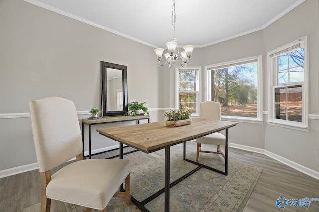 1816 Devonshire Dr SE, Decatur, AL 35601 - dining room with a chandelier, wood finished floors, baseboards, and ornamental molding