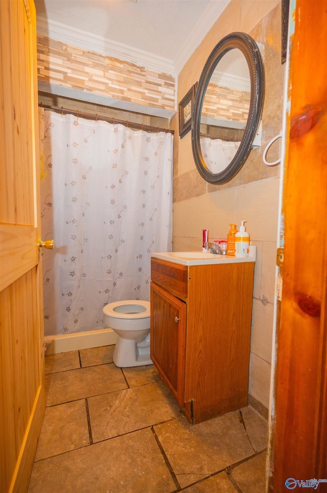 bathroom with vanity and ornamental molding