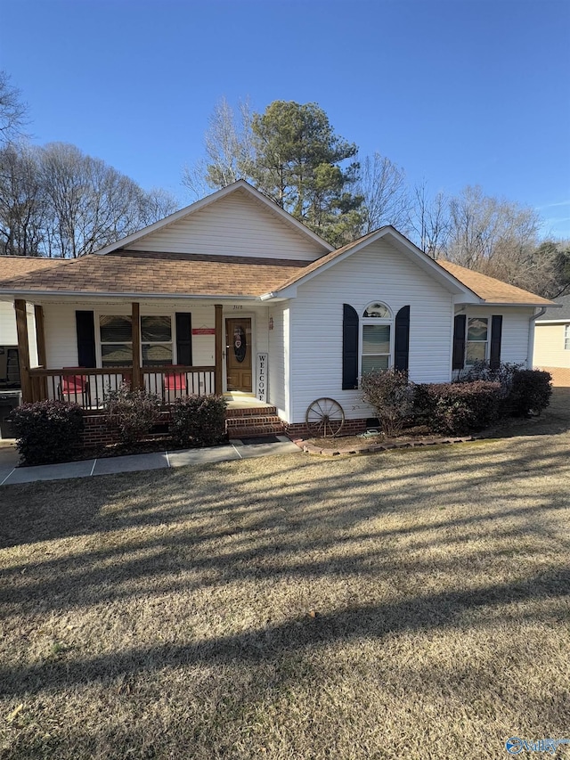 view of front of house featuring a front yard and covered porch