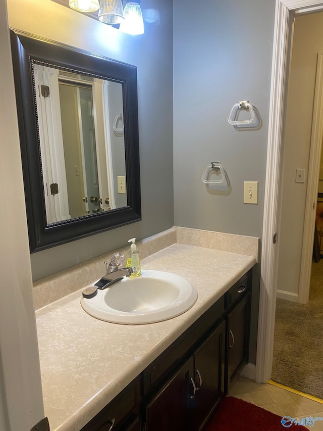 bathroom with tile patterned flooring and vanity