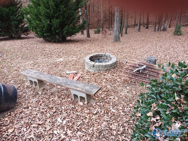 view of yard featuring a fire pit