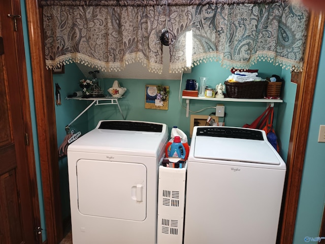 washroom with washing machine and clothes dryer