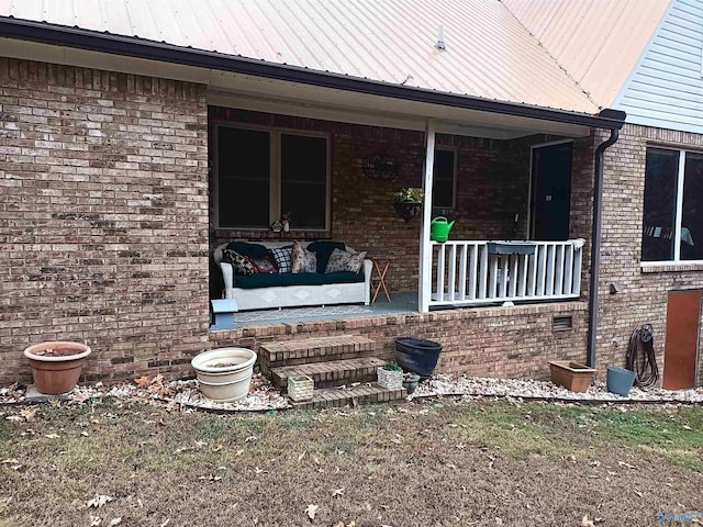 view of exterior entry with an outdoor hangout area