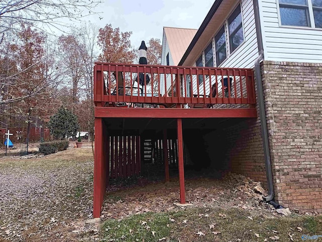 view of side of property featuring a wooden deck