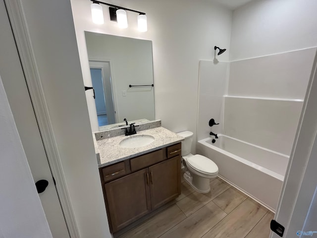 full bathroom with shower / washtub combination, vanity, and toilet