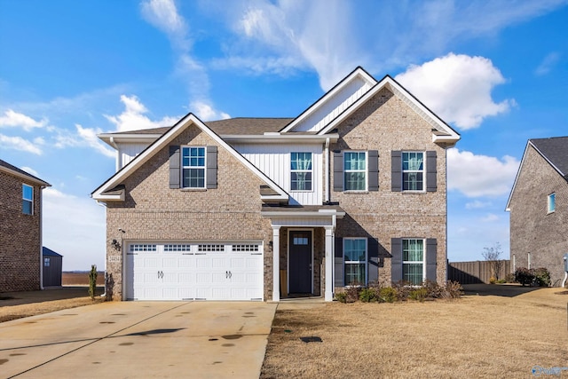 view of front of property with a garage, brick siding, fence, concrete driveway, and board and batten siding