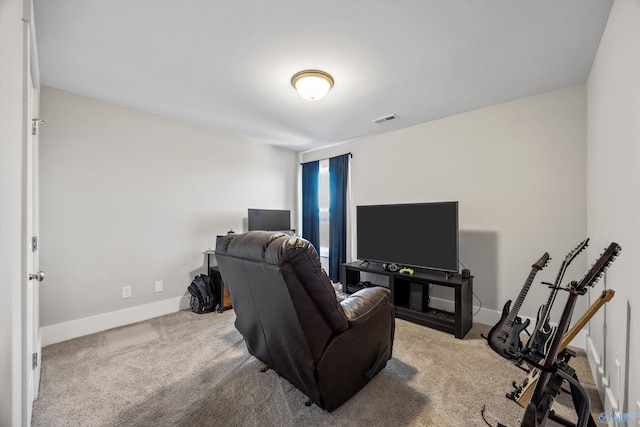 living area with carpet, visible vents, and baseboards