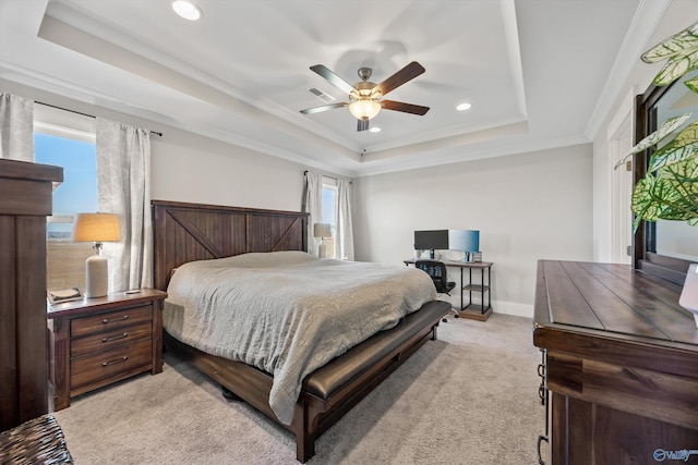 bedroom with light carpet, visible vents, baseboards, ornamental molding, and a tray ceiling