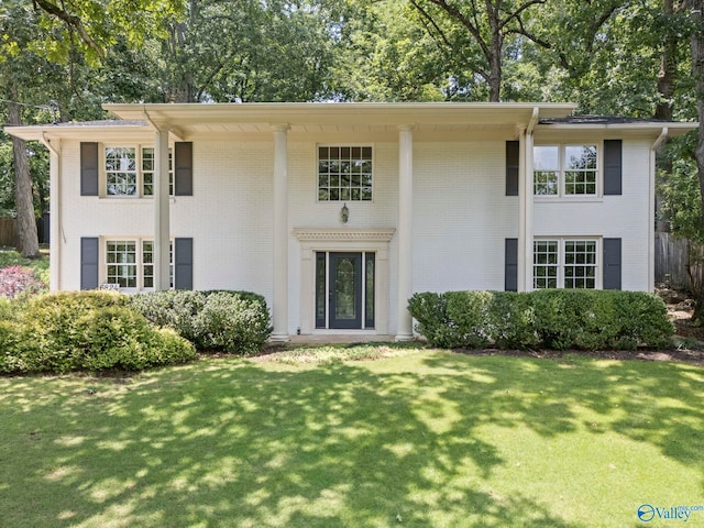 6824 Criner Rd SE, Huntsville, AL 35802 - greek revival inspired property featuring brick siding, a front yard, and view of wooded area