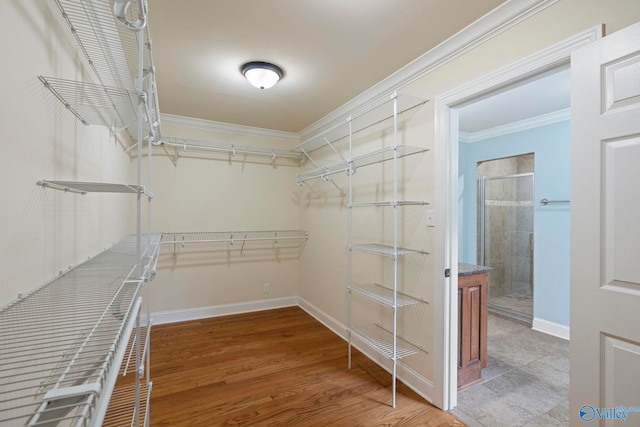 6824 Criner Rd SE, Huntsville, AL 35802 - walk in closet featuring wood finished floors