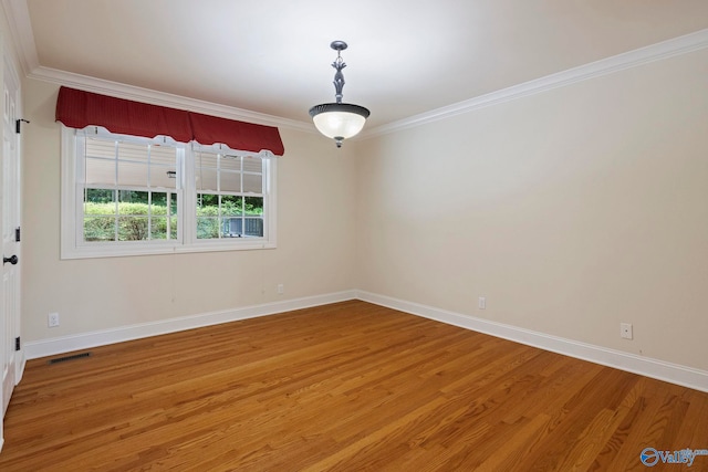 6824 Criner Rd SE, Huntsville, AL 35802 - empty room with light wood-type flooring and crown molding