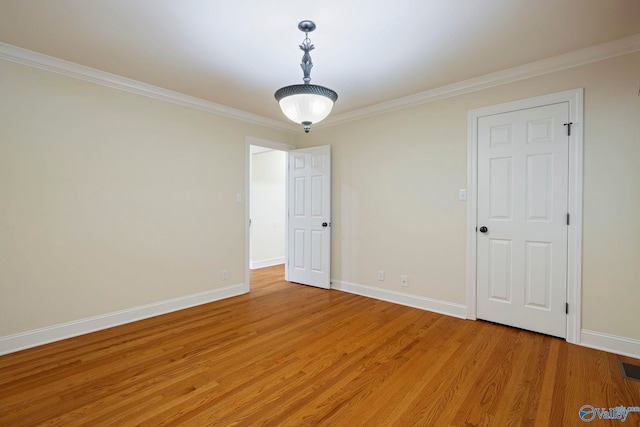 6824 Criner Rd SE, Huntsville, AL 35802 - empty room with light wood-style floors and ornamental molding
