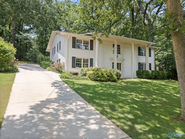 6824 Criner Rd SE, Huntsville, AL 35802 - view of front facade with a front yard, stucco siding, and driveway