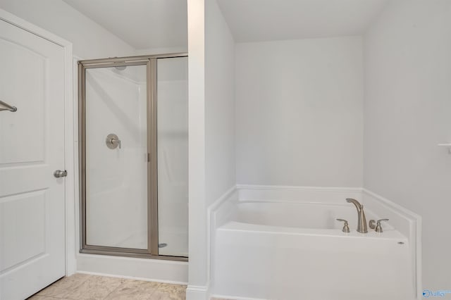 full bathroom featuring a stall shower and a bath