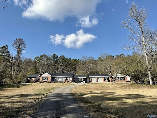 view of front of home with a front lawn