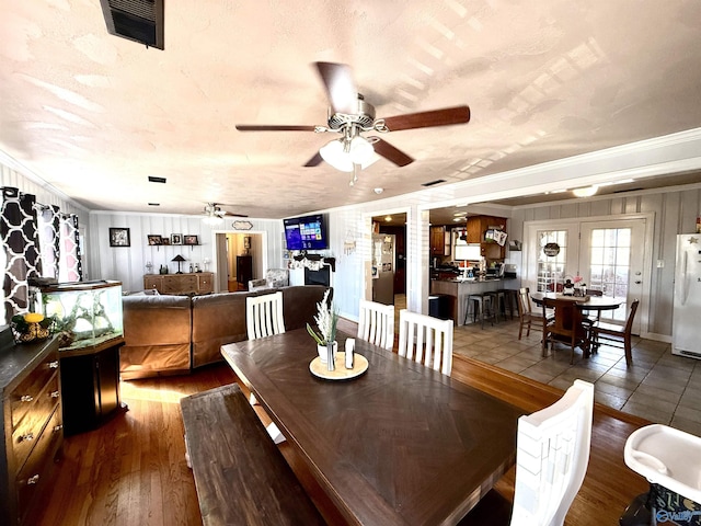 dining room featuring hardwood / wood-style flooring, ceiling fan, and ornamental molding