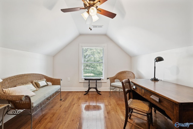 sitting room with ceiling fan, lofted ceiling, and light hardwood / wood-style flooring