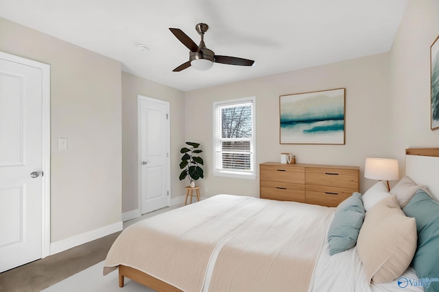 bedroom featuring baseboards, carpet floors, and ceiling fan