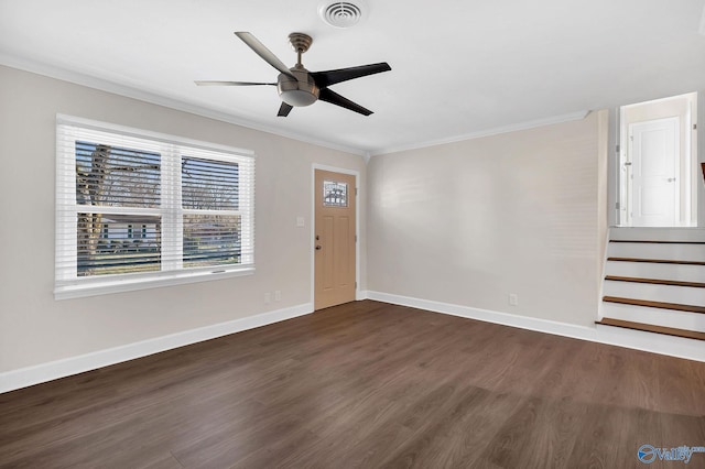 entrance foyer with visible vents, dark wood-type flooring, baseboards, crown molding, and a ceiling fan