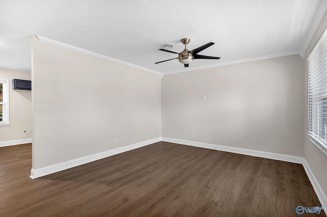 empty room featuring dark wood-type flooring, a ceiling fan, baseboards, and ornamental molding