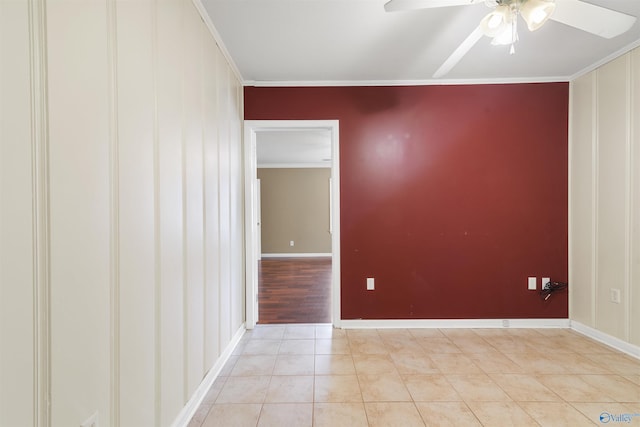 unfurnished room with light tile patterned floors, baseboards, crown molding, and ceiling fan