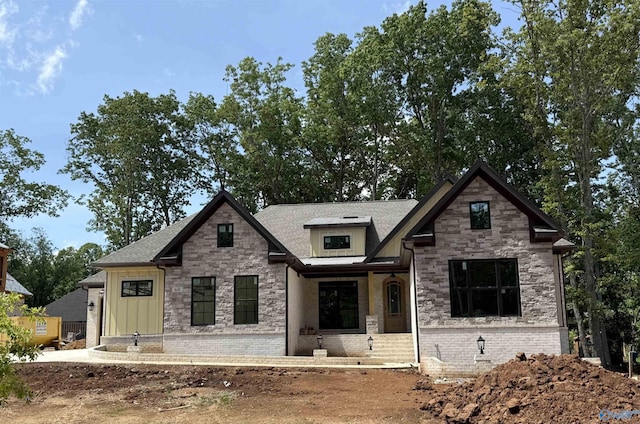 60 Trail Loop Rd, Huntsville, AL 35803 - view of front of house featuring stone siding, roof with shingles, and brick siding