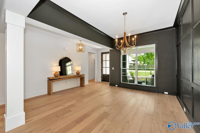 60 Trail Loop Rd, Huntsville, AL 35803 - unfurnished dining area featuring a chandelier and light wood-type flooring