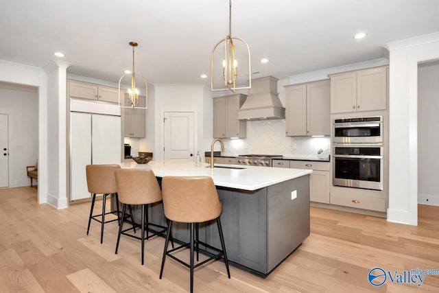 60 Trail Loop Rd, Huntsville, AL 35803 - kitchen with custom exhaust hood, white built in refrigerator, double oven, crown molding, and a breakfast bar area