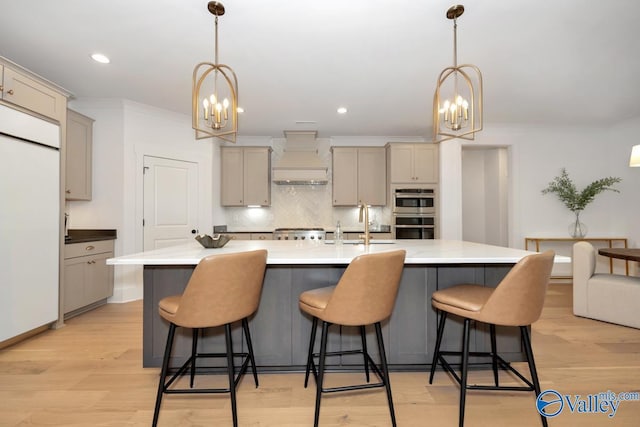 60 Trail Loop Rd, Huntsville, AL 35803 - kitchen with a chandelier, custom exhaust hood, gray cabinets, backsplash, and crown molding
