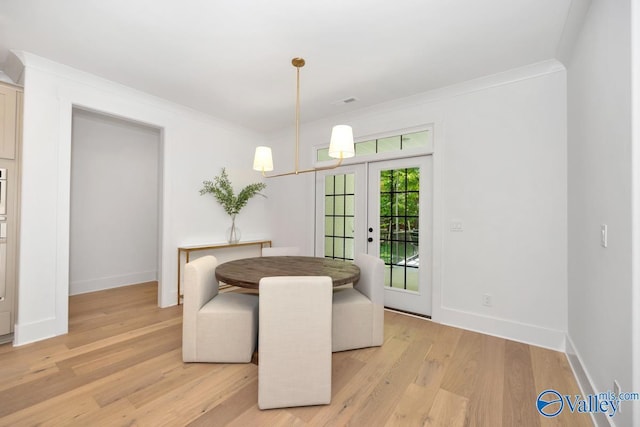 60 Trail Loop Rd, Huntsville, AL 35803 - dining space featuring french doors, light wood-style floors, and ornamental molding