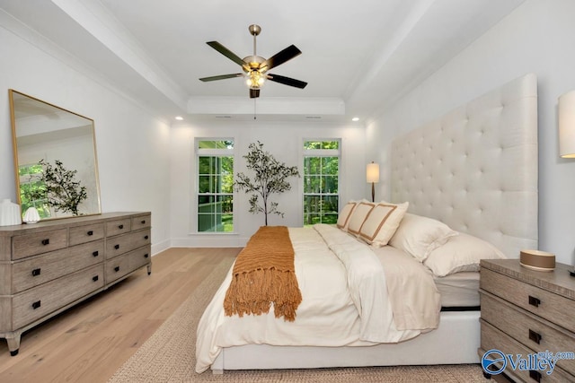 60 Trail Loop Rd, Huntsville, AL 35803 - bedroom with light wood finished floors, a tray ceiling, ornamental molding, ceiling fan, and recessed lighting