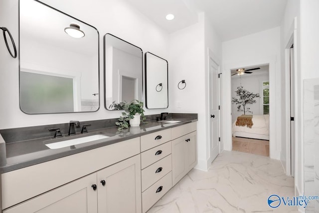 60 Trail Loop Rd, Huntsville, AL 35803 - ensuite bathroom with marble look tile flooring, double vanity, and ceiling fan