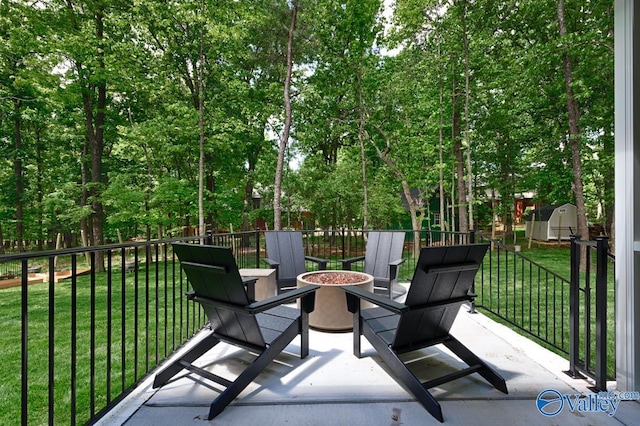 60 Trail Loop Rd, Huntsville, AL 35803 - view of patio featuring a shed and an outdoor fire pit
